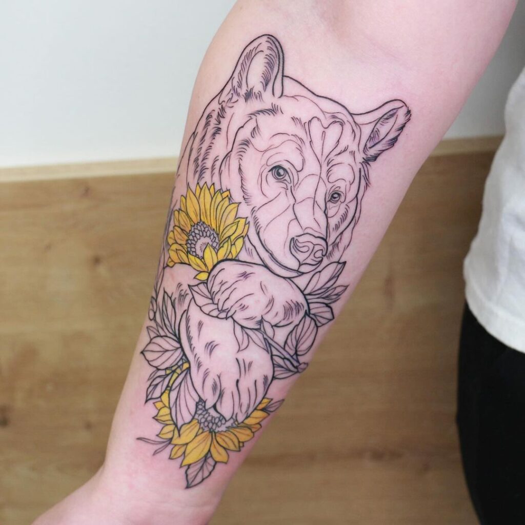 Entfesseln Sie Ihr inneres Gebrüll mit diesen 24 mutigen Bären-Tattoo-Ideen