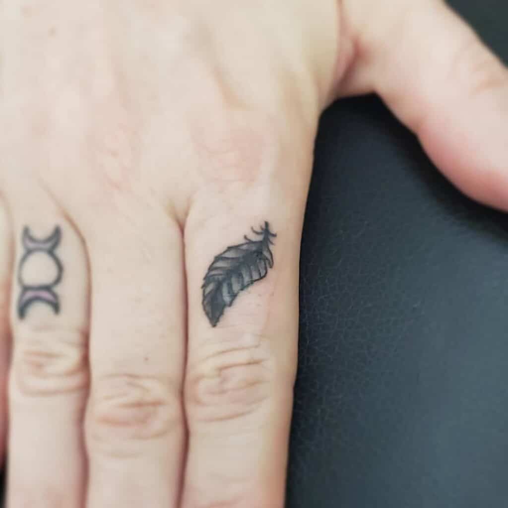 11 Epic Feather On Finger Tattoo Ideas To Wear Like A Ring