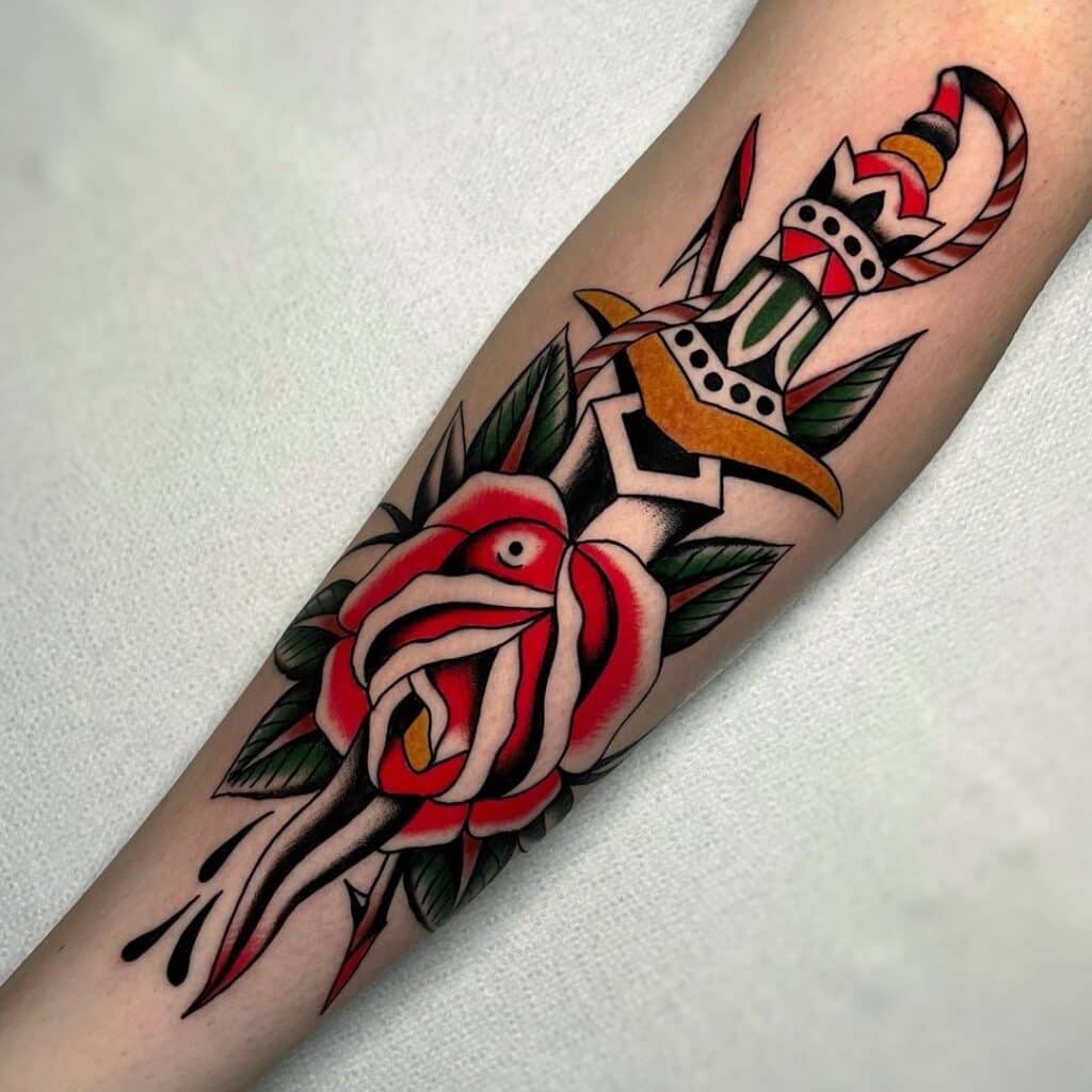 Rosa com punhal significado da tatuagem e 20 desenhos de tinta emocionantes