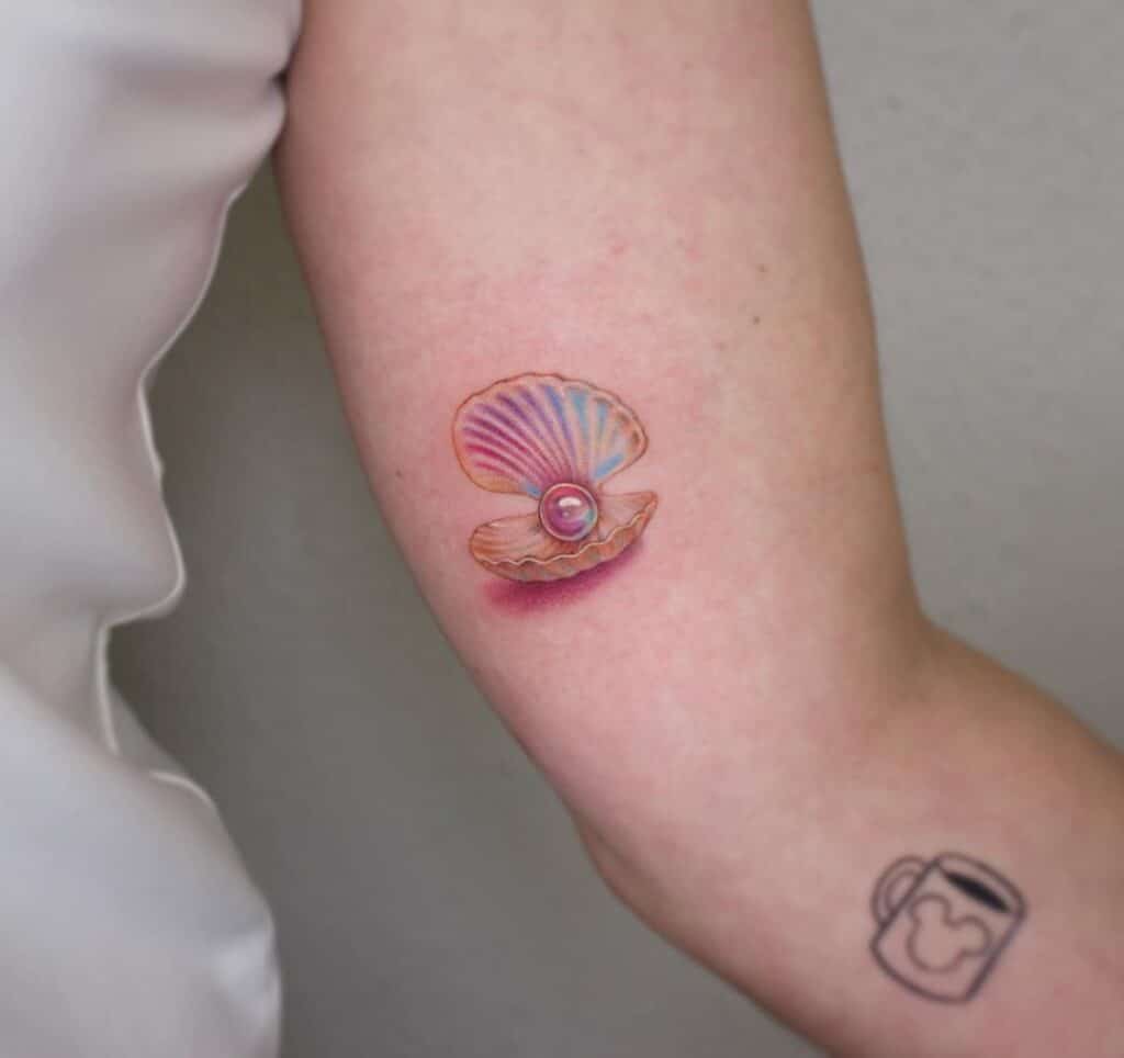 21 unwiderstehliche Perlen-Tattoo-Ideen zum sofortigen Eintauchen